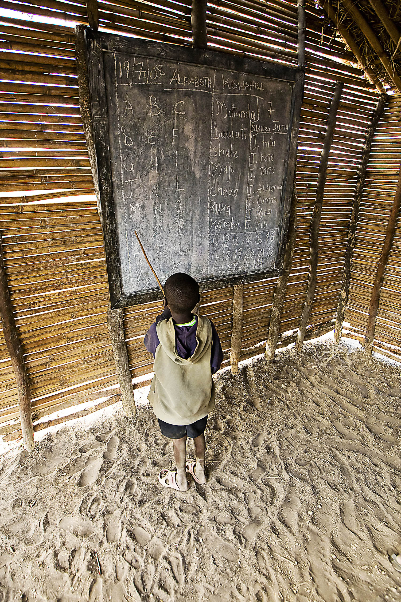 Young boy learning the alphabet in African school