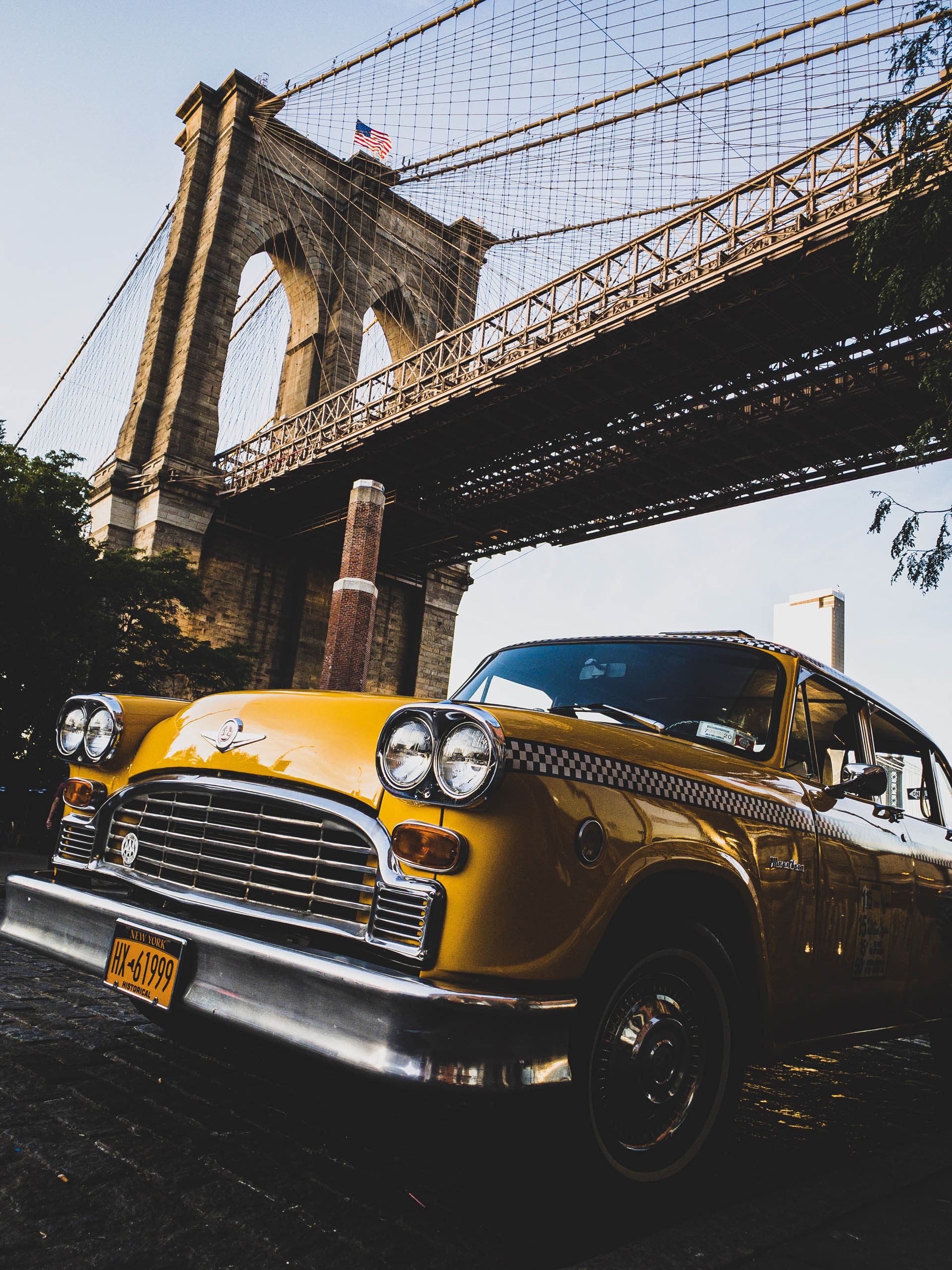 Vintage taxi under Brooklyn Bridge