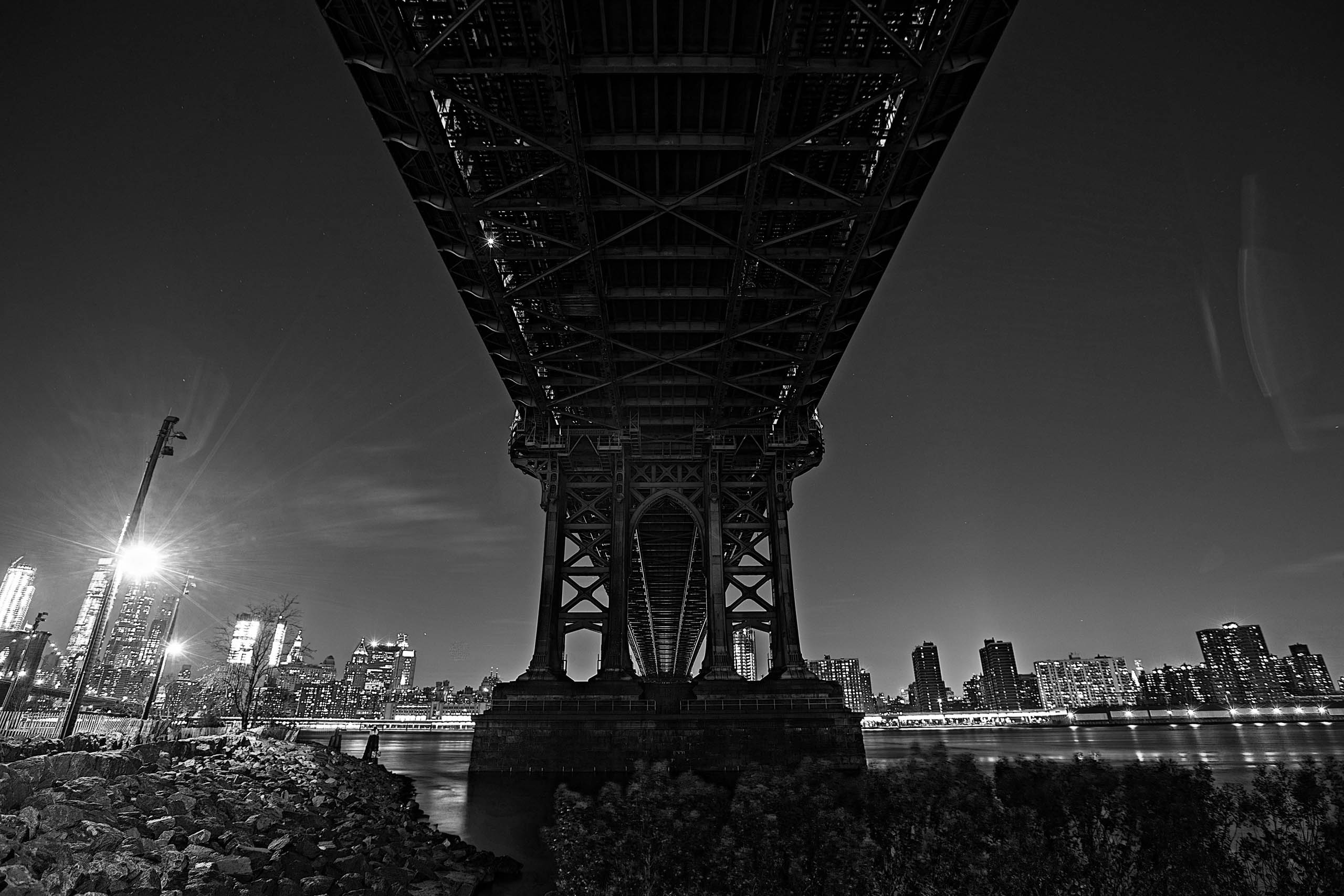 Under the Manhattan bridge at night in New York
