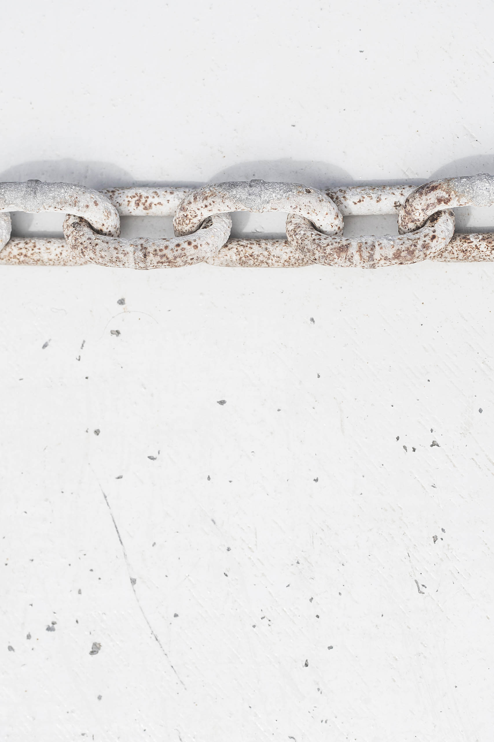 Rusty iron chain on white background